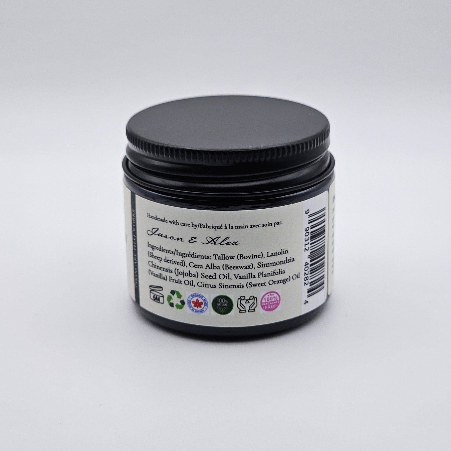 Jar of natural tallow with showing the ingredients label on a white background