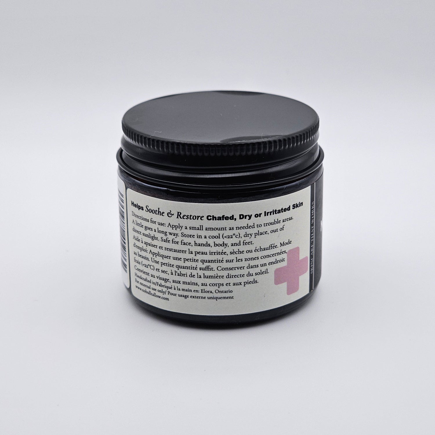 Jar of Raw Hide Relief tallow skin repair cream on a white background
