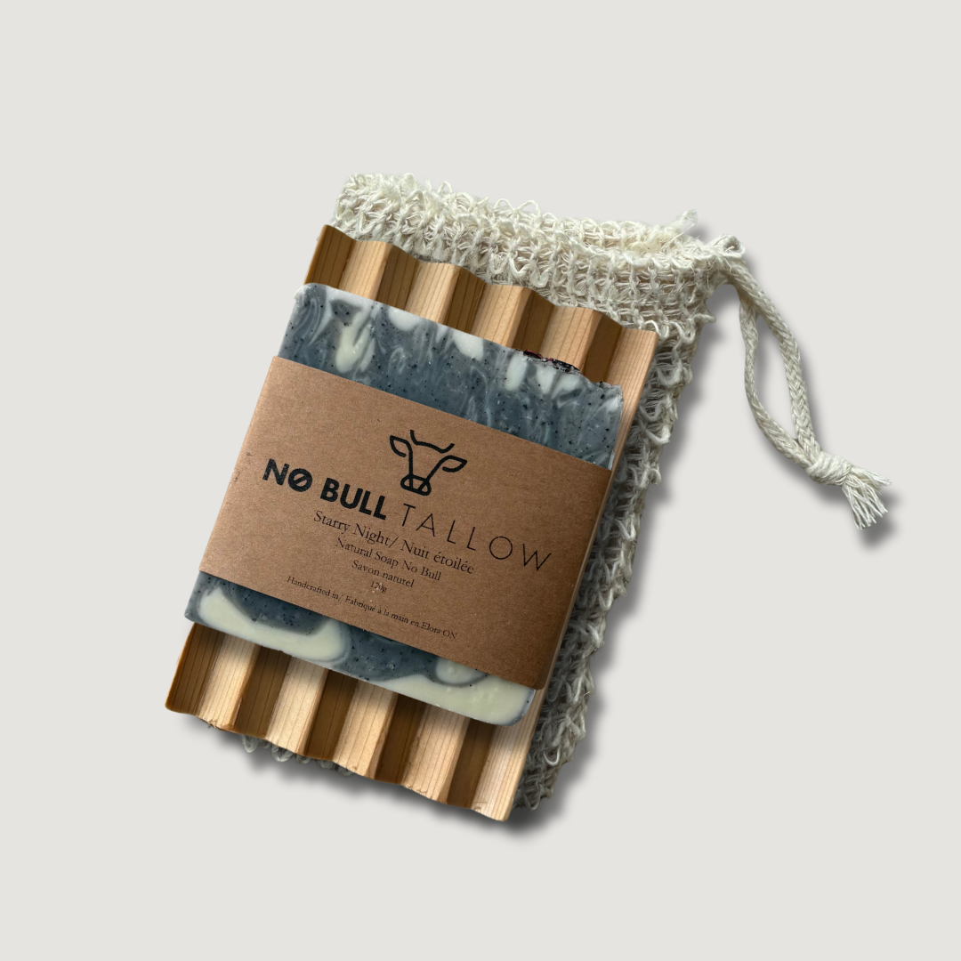 Pure tallow soap bar on top of a cedar soap dish and hemp soap saver