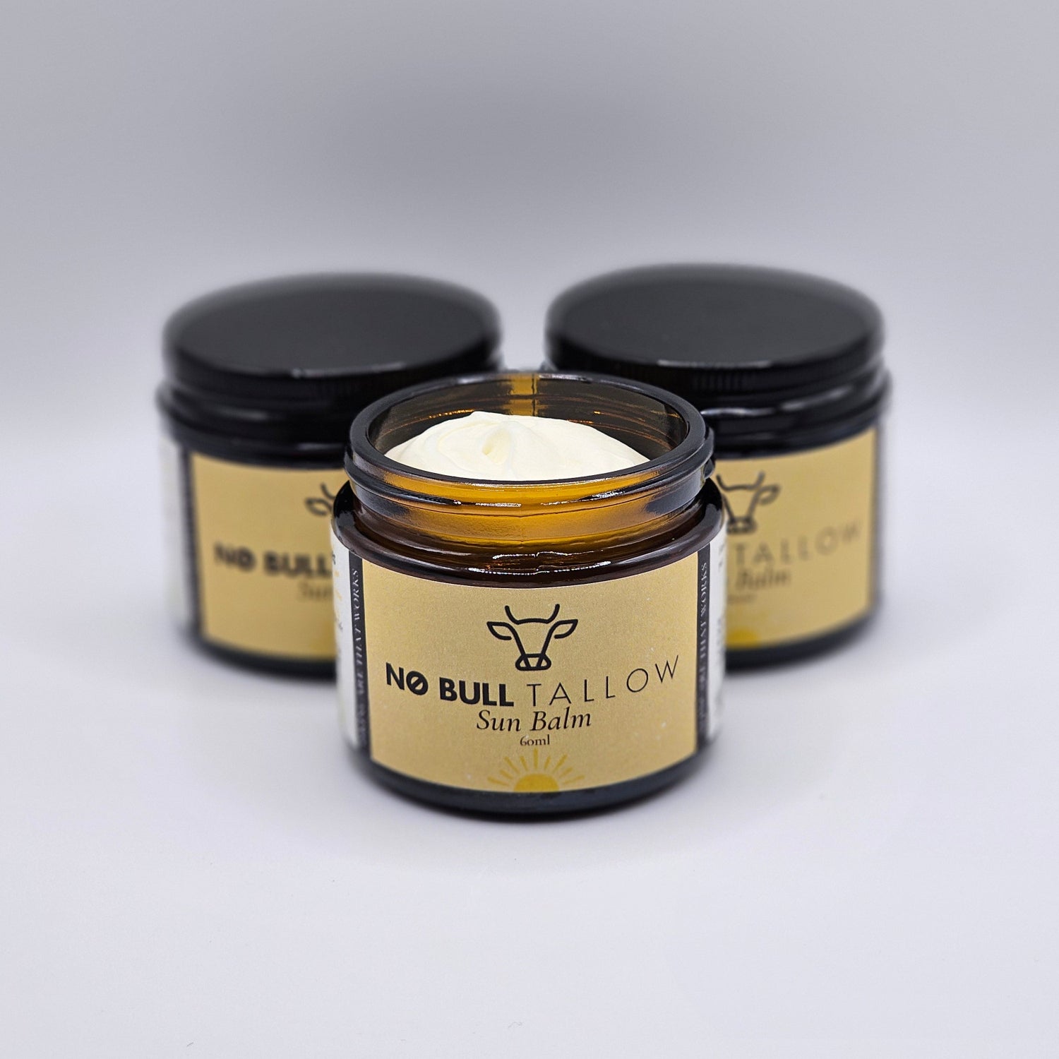 3 jars of natural beef tallow sun balm on white backrop