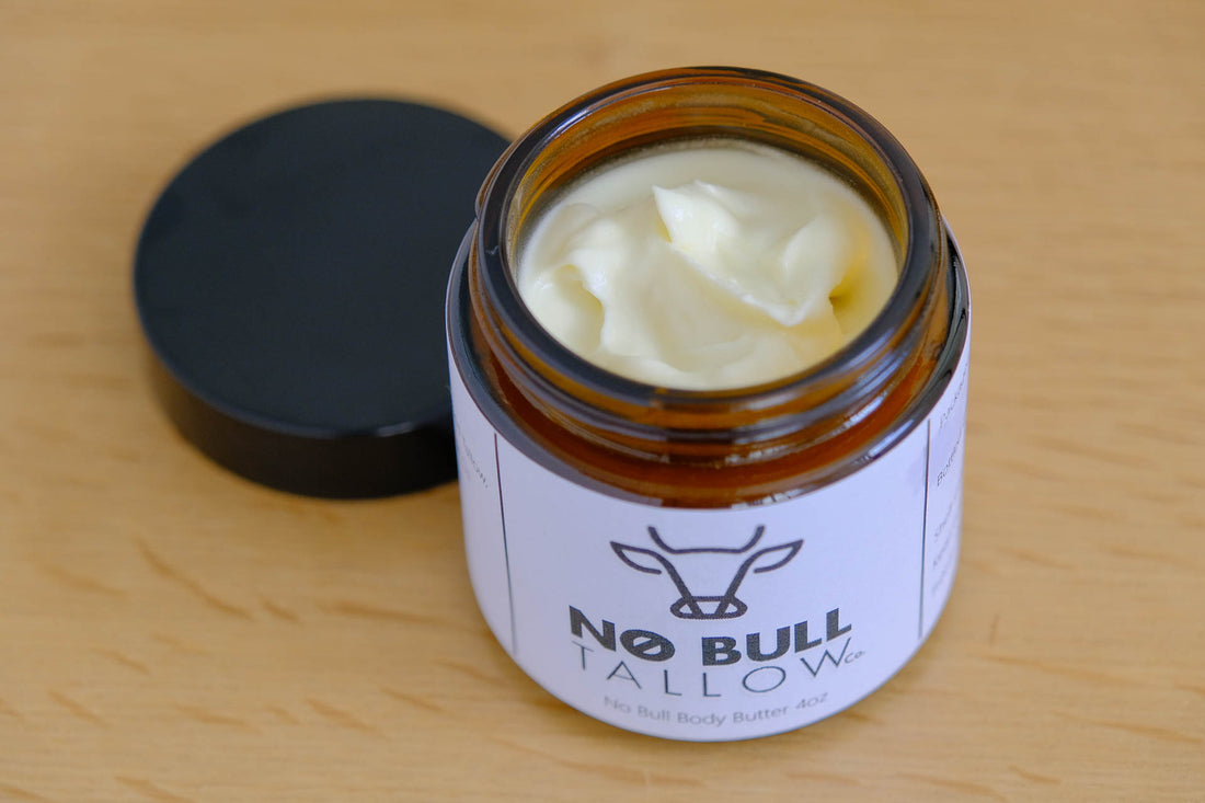 Tallow based body butter, lid open, smooth luxurious cream.