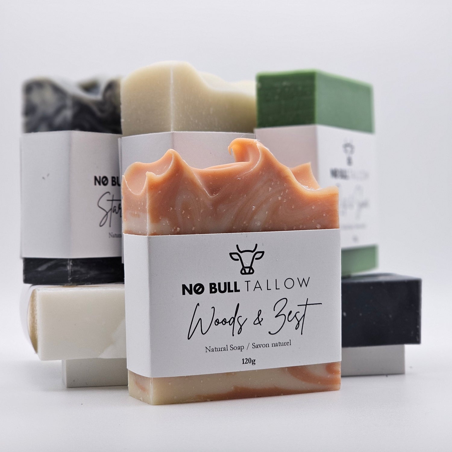 Assorted tallow soap bars on beige background - Handcrafted natural soap collection for healthy skin