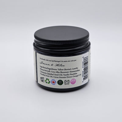 Jar of natural tallow with showing the ingredients label on a white background