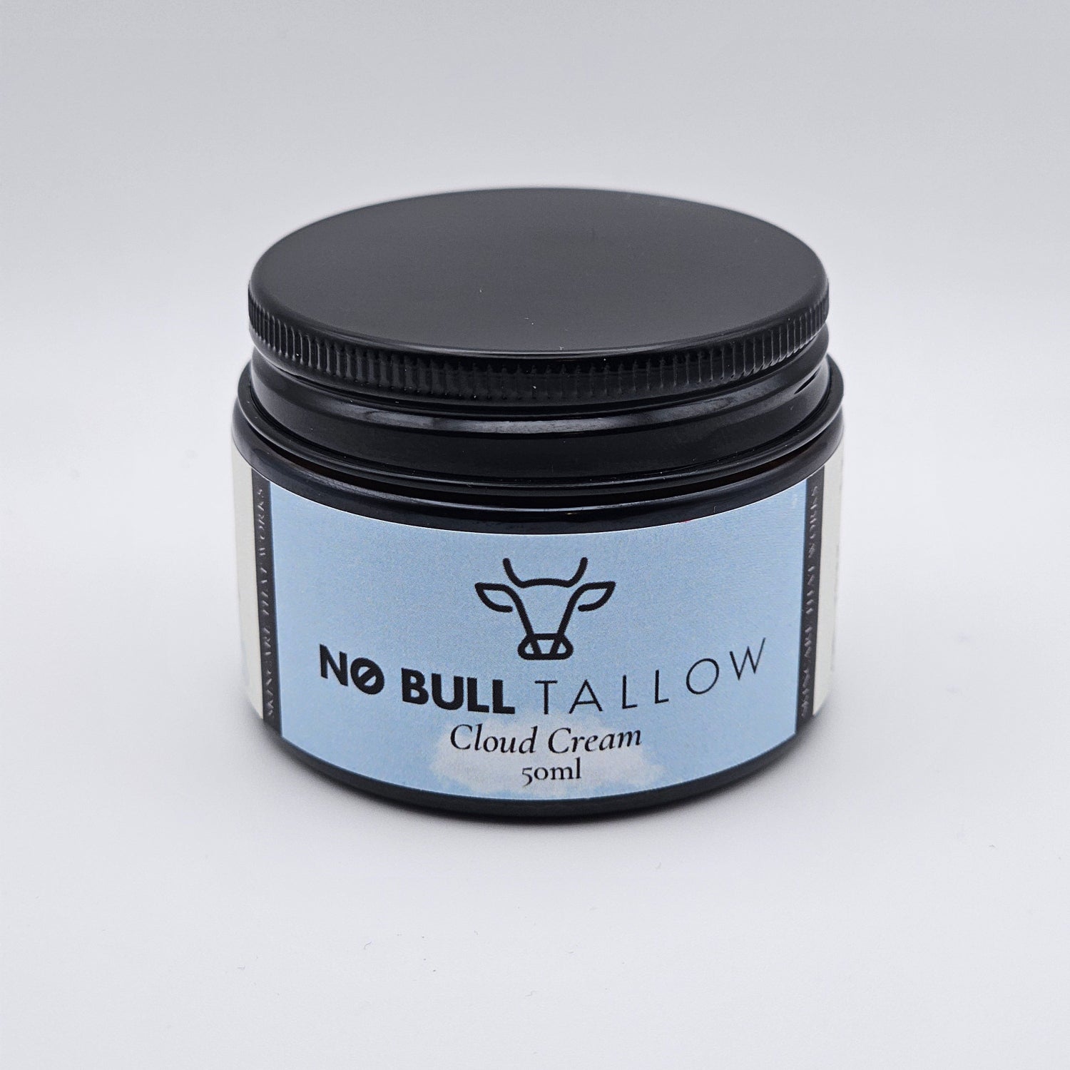 a jar of premium tallow face moisturizer on white backdrop