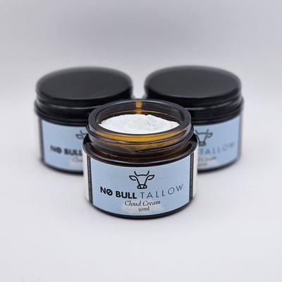 Three jars of 'No Bull Tallow' Cloud cream on a white background