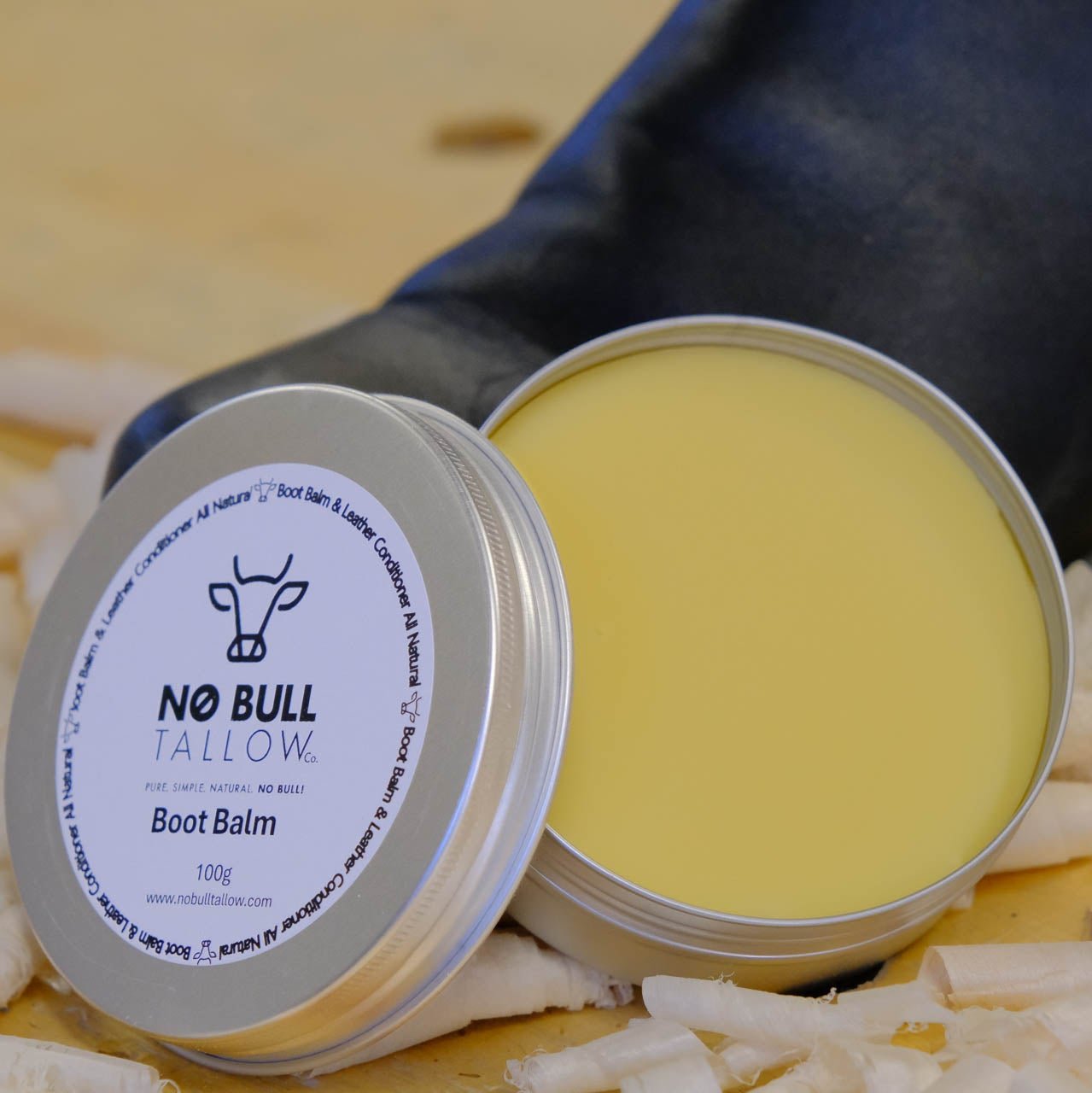 No bull tallow leather conditioner infront of a boot