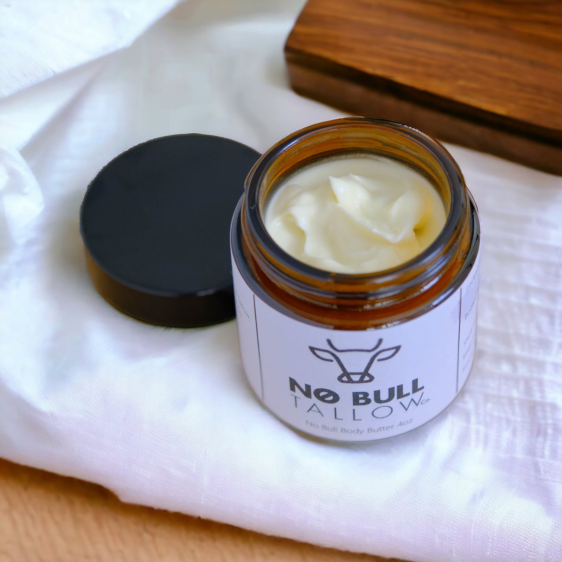 original body butter in jar with lid off