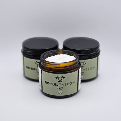 Three jars of Pure No Bull Tallow on a white background