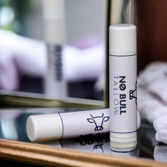 tallow lip balm on glass counter