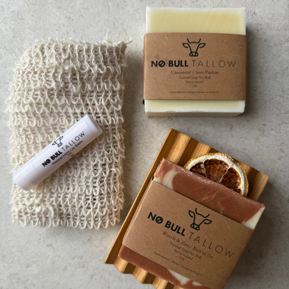 Natural skincare bundle with tallow soaps, cedar soap tray, lip balm, and reusable hemp soap saver bag